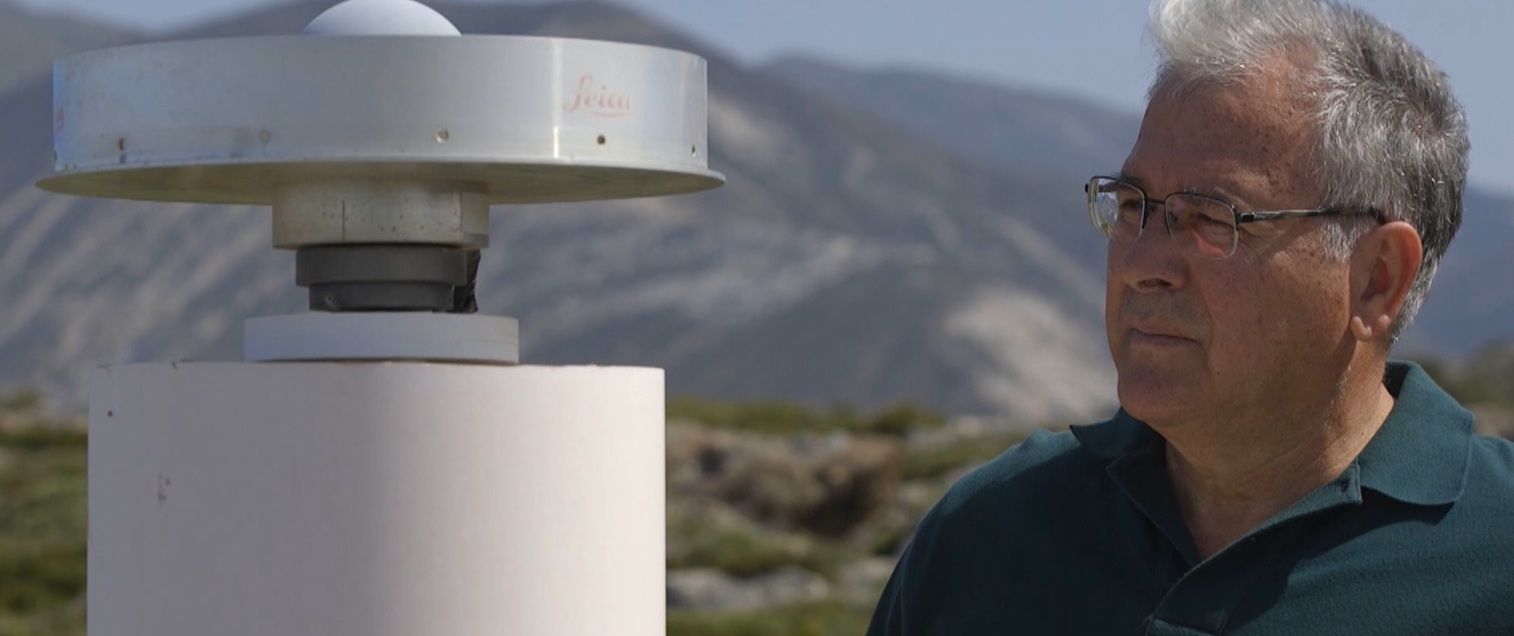 Stelios Mertikas beside field instrumentation